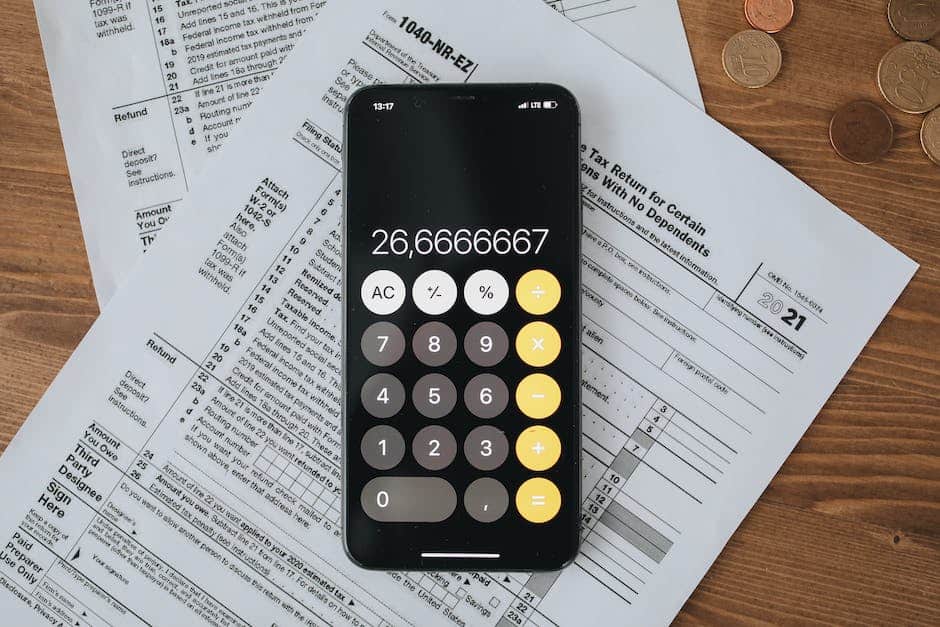 Typing hands on a keyboard with a tax form and calculator in the background, symbolizing the need for tax resolution services.